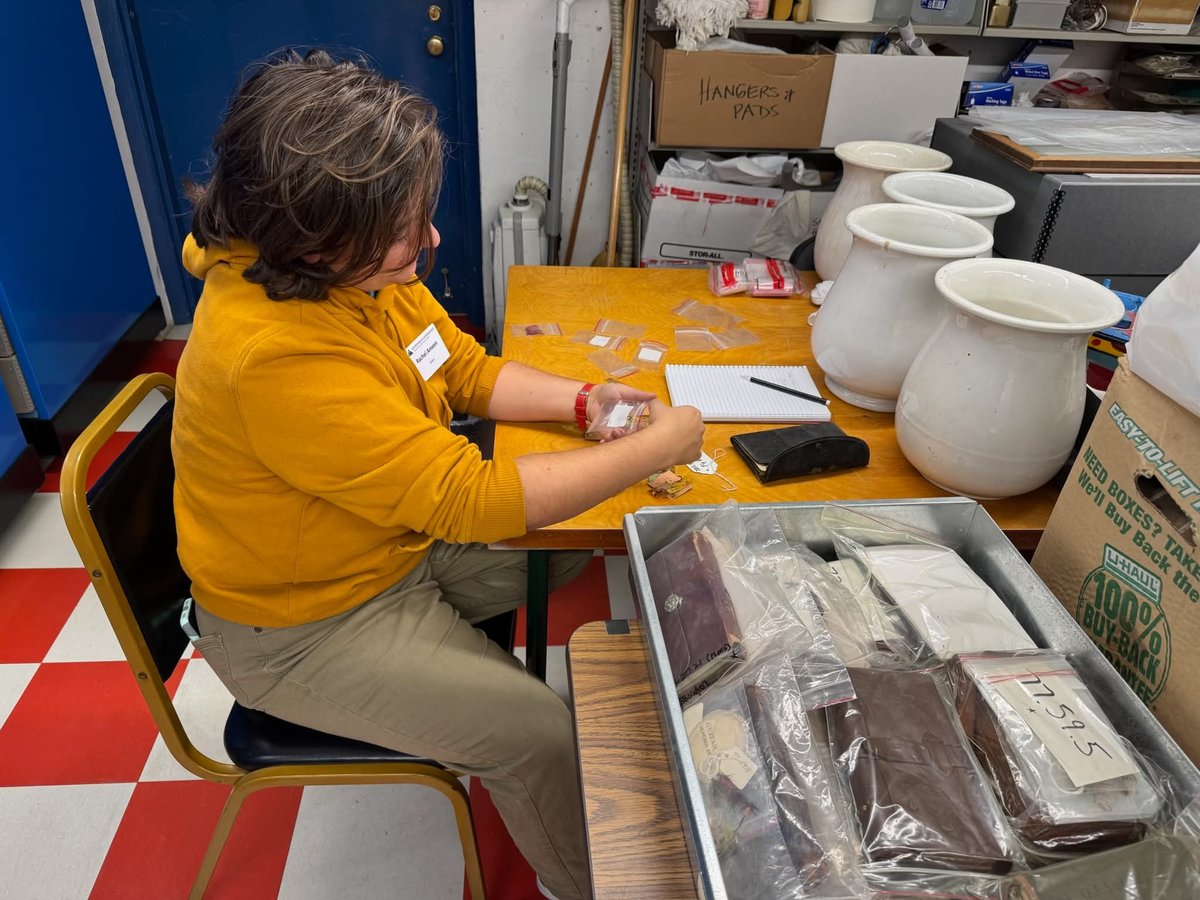 Rachel Ameen working with archival materials